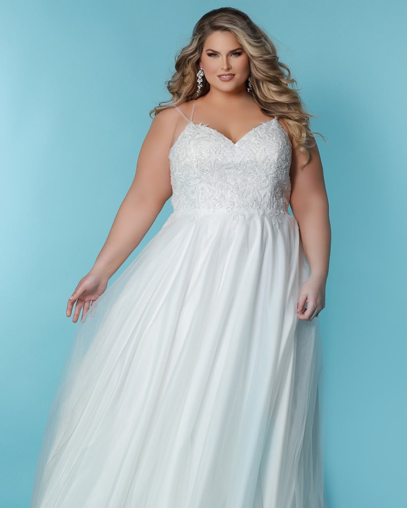 Front of a model wearing a size 28 Dalia Wedding Dress in Ivory by Sydney's Closet. | dia_product_style_image_id:285912